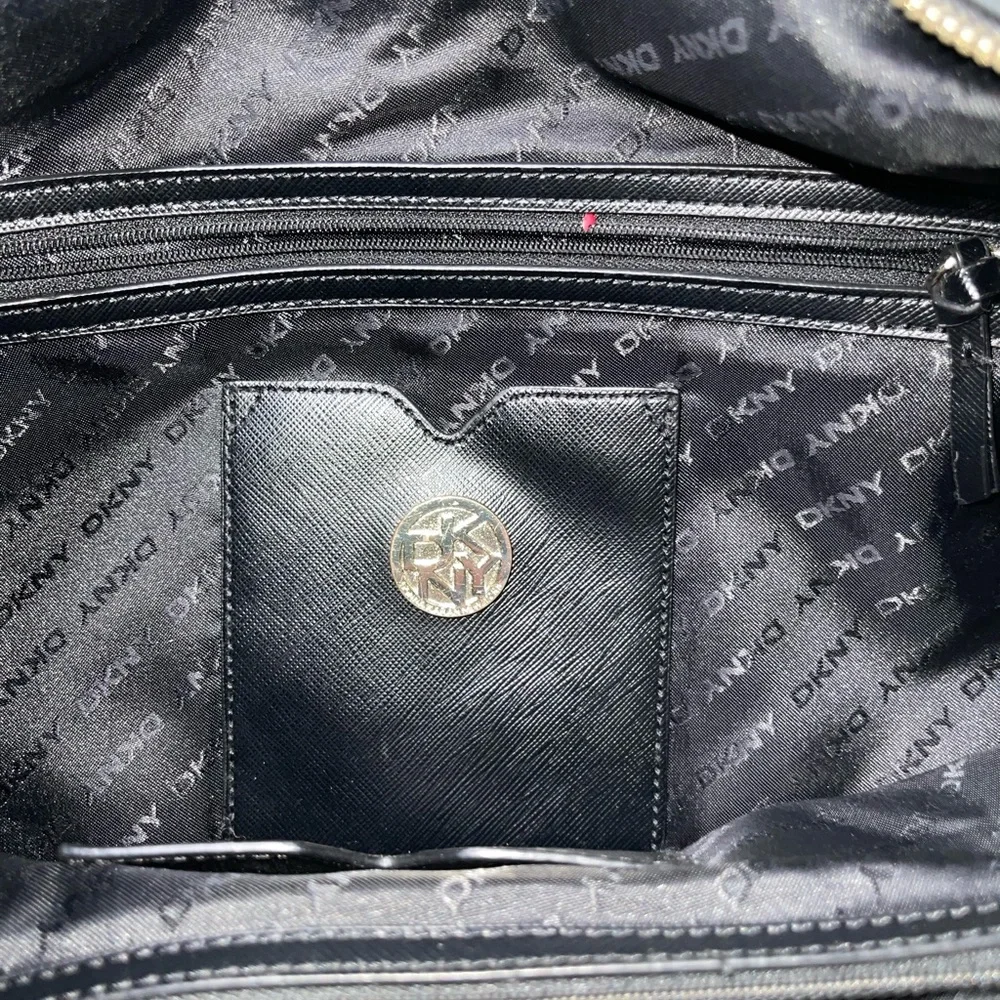 DKNY black leather shoulder bag with stud detailing.